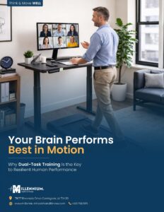 A photo of a man in a virtual meeting while also simultaneously walking on a walking pad at work.
